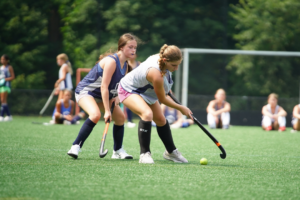 Girl Dodging Field Hockey Camp Team